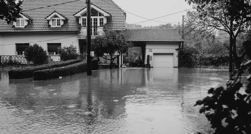Suburban Fairfax-area house surrounded by high floodwater